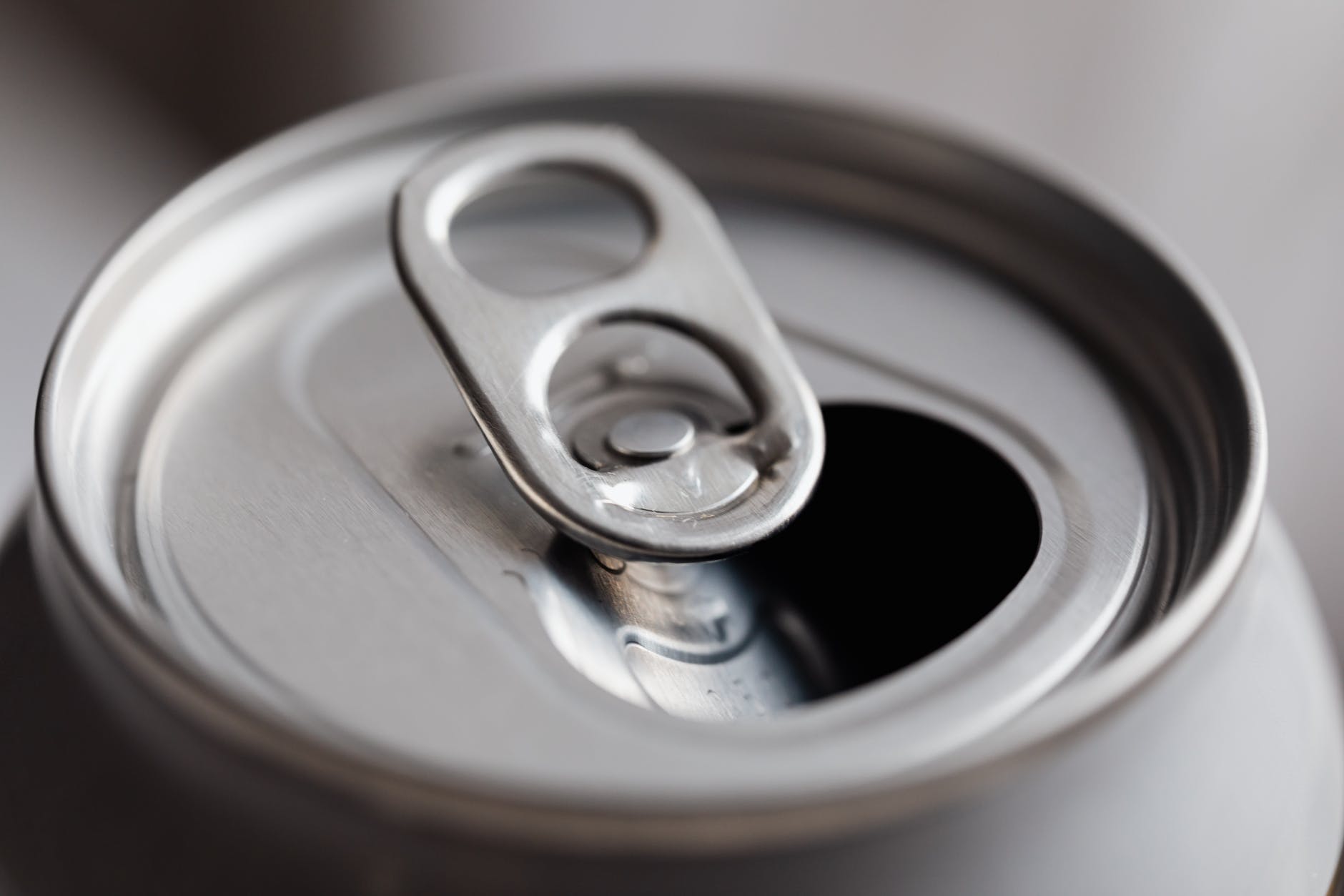 open grey metal soda can